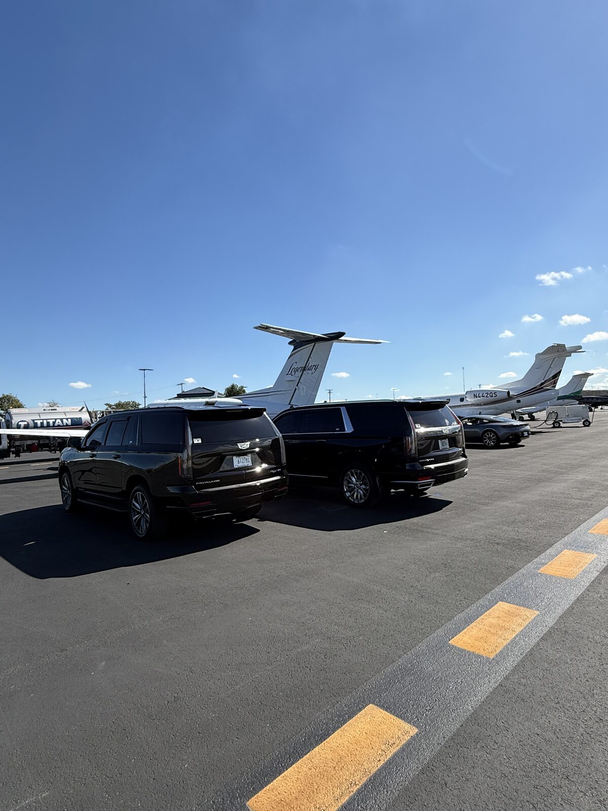 Escalades alongside private jets at BNA