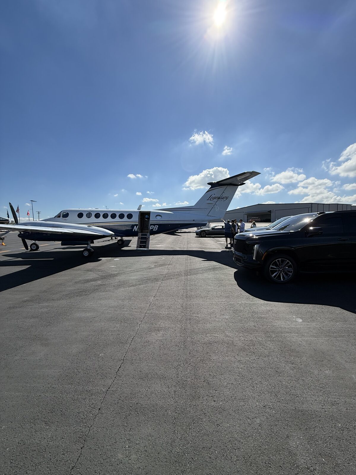 Cadillac Escalade meeting a private jet at BNA
